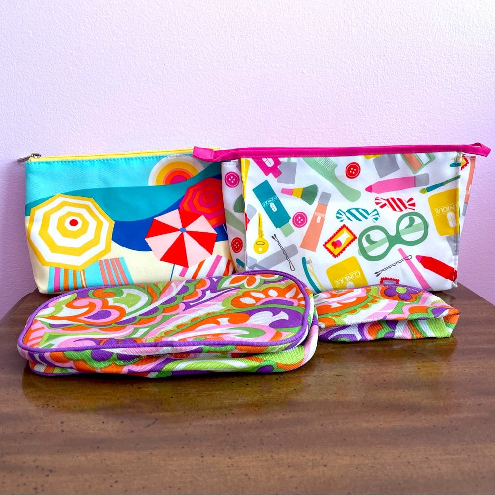 4 CLINIQUE makeup bags in various sizes with 2 mystery  makeup gifts 🎁